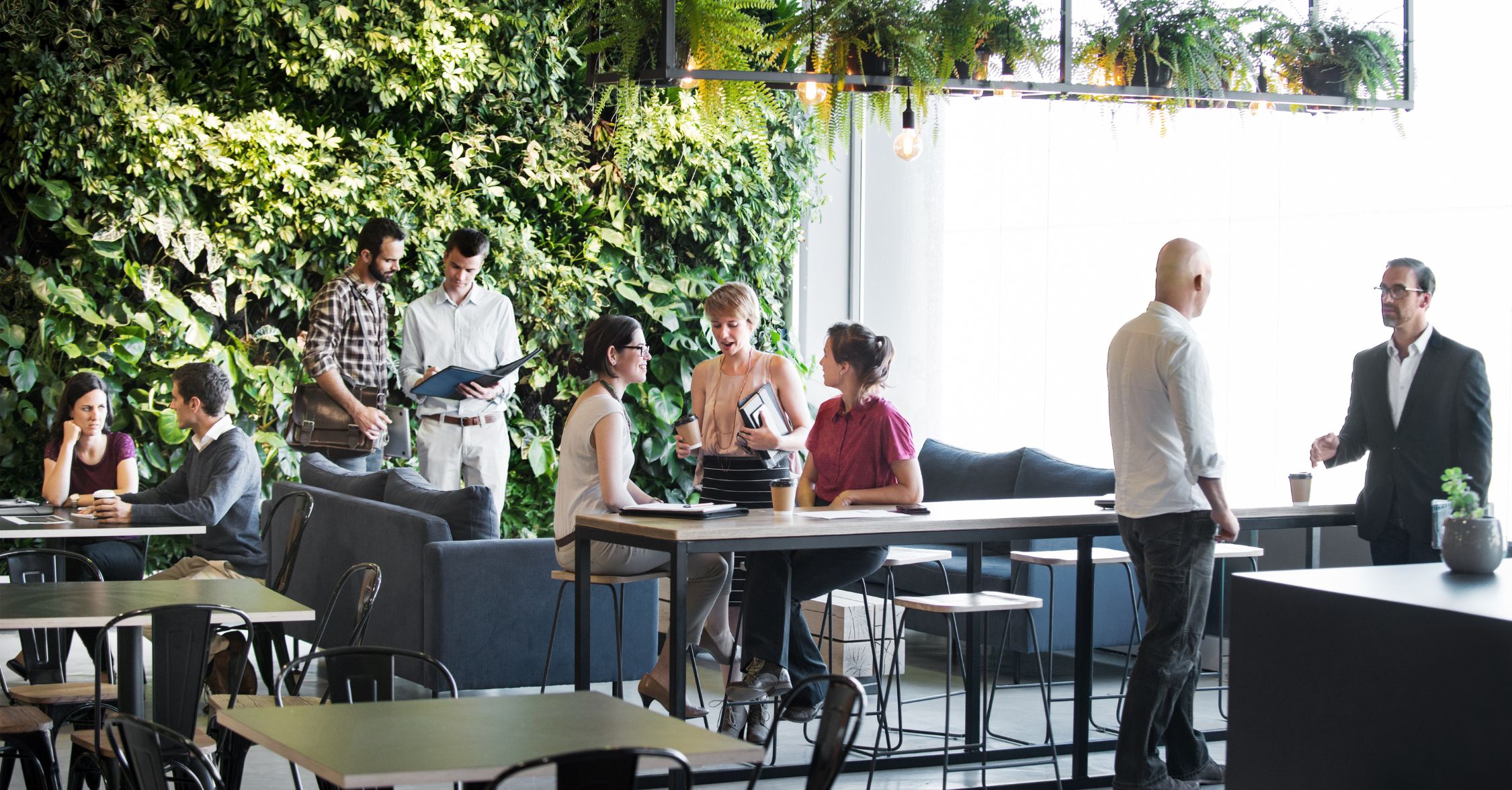 Recruitment agency office workers discussing the Government's Guaranteed Hours Consultation.